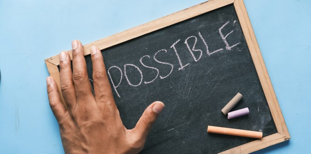 a chalkboard with the word possible written on it